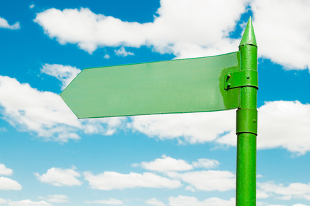 blank road sign against blue sky background の写真素材