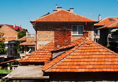 Red rooftops of old residential houses with view in their backyards, Bulgaria の写真素材