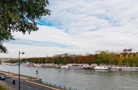 river seine in paris on a cloudy day の写真素材