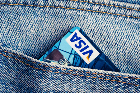 YEKATAERINBURG, RUSSIA - APR 25, 2014: Visa Debit Cards in blue denim jeans pocket. VISA is one of the three biggest brands. のeditorial素材