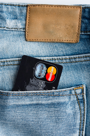 YEKATAERINBURG, RUSSIA - APR 25, 2014: Mastercard Debit Cards in blue denim jeans pocket. のeditorial素材