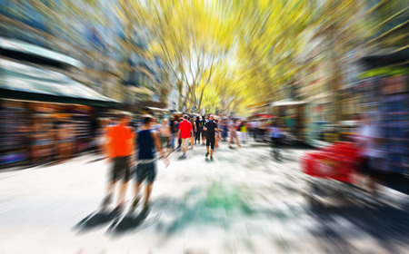 picture in zoom effect of people in the shopping street of the city 