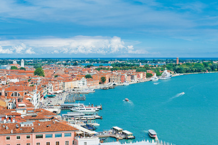 Beautiful views of the Mediterranean traditional houses Venice with red tile roofs from Campanile di San Marco. Venice, Italy, Europe の写真素材