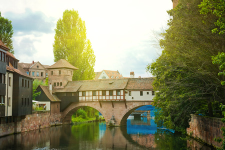 NUREMBERG, GERMANY JULY 22: Nuremberg (Nurnberg), Germany, Europe. River detail and bridge. Nuremberg accommodates annually more than 2 millions tourists のeditorial素材