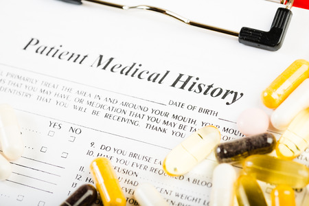 Medical history document with medicineの写真素材