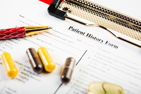 Medical history document with medicineの写真素材