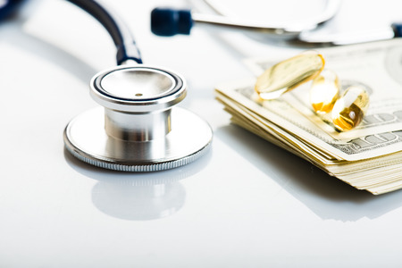 Healthcare cost concept: stethoscope and dollarsの写真素材