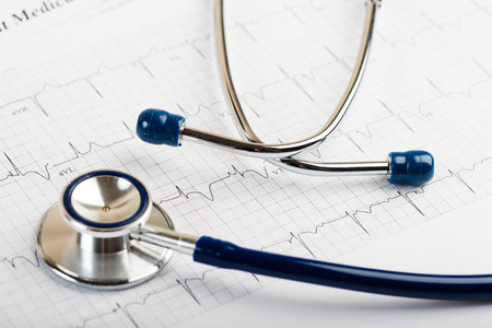 Stethoscope on cardiogram concept for heart careの写真素材