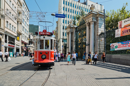 ISTANBUL, TURKEY - AUGUST 27 2013: Retro tram moves along a busy Istiklal street in Istambul.  It is the most famous street in Istanbul, visited by nearly 3 million people in a single weekends dayのeditorial素材
