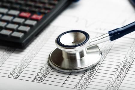 Health care costs. Stethoscope and calculator symbol for health care costs or medical insuranceの写真素材