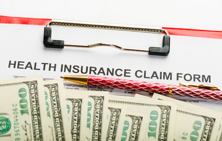 Health insurance application form with banknote concept for life planningの写真素材