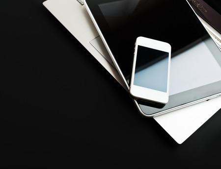 keyboard with phone and tablet pc on black backgroundの写真素材
