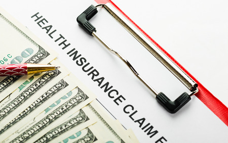 Health insurance application form with banknote concept for life planningの写真素材