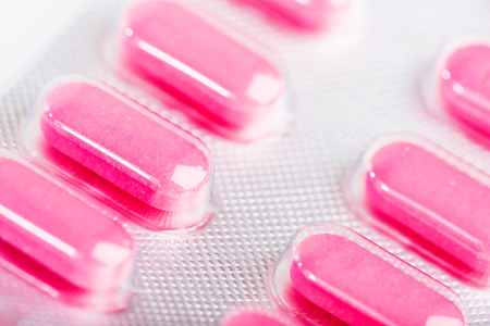 Pink tablet pills in blisterの写真素材
