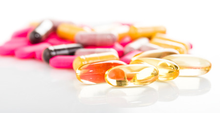 Group of  medical pills isolated on white backgroundの写真素材