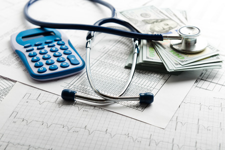 Health insurance application form with banknote and stethoscope concept for life planningの写真素材