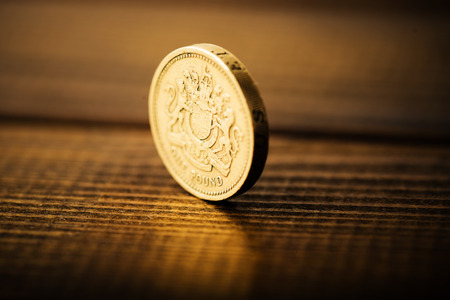 pound GBP coin on the deskの写真素材