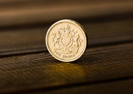 pound GBP coin on the deskの写真素材
