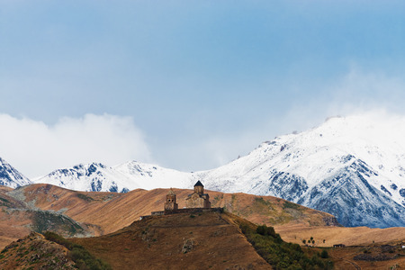 Gergeti Trinity church Tsminda Sameba in Kazbegi (Stepantsminda) village, Georgia, Europe.