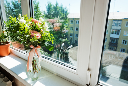 beautiful bouquet of flowers in vase on a windowsill
の写真素材