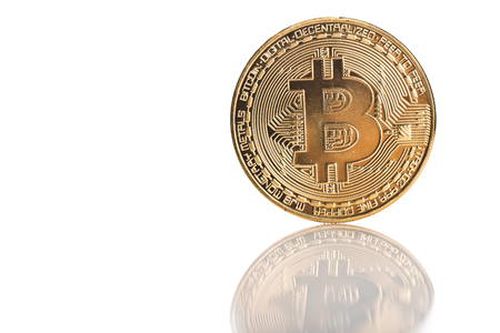 Golden bitcoin with reflection isolated on white backgroundの写真素材