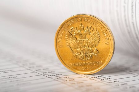One ruble coin on a summary table (shallow DOF)の写真素材
