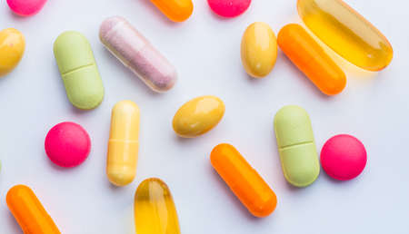 pills and capsule on white background