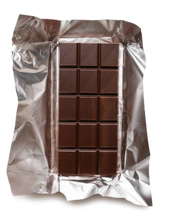 Chocolate bar in foil isolated on white backgroundの写真素材