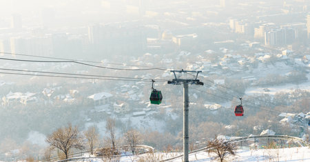 Cable car during winter could. Smog is often formed in Almaty due to landscape imperfections. Kazakhstanの写真素材