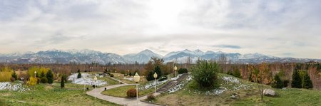 Park in autumn and mountains in the background. Almaty. Kazakhstanの写真素材