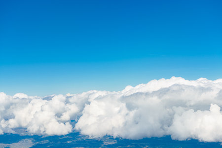 View from the window of an airplane flying in the cloudsの写真素材