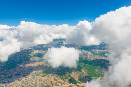 View from the window of an airplane flying in the cloudsの写真素材