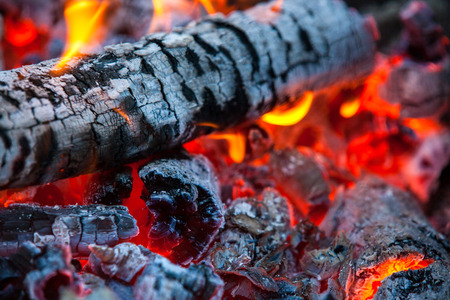 Burning and glowing charcoal with a hot flame in the background. Coal for BBQ Party, Grill Meatの写真素材