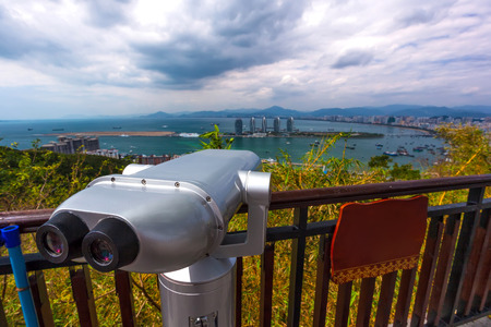 Binoculars for viewing the panorama of the city. Sanya Phoenix Island President Resort Apartment, Hainan Sheng, Sanya Shi, Tianya Qu, China. Picture was taken from Luhuitou Peak Park.の写真素材