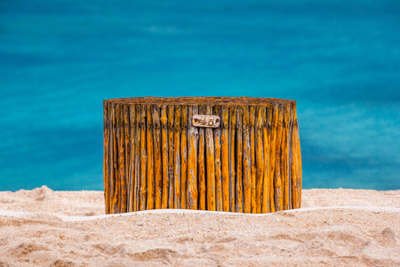 The seat is made of bamboo rods on a sandy beach on the background of the sea. Located in the middle. 48 hours on the beach, Gili Trawangan, Indonesia.の写真素材