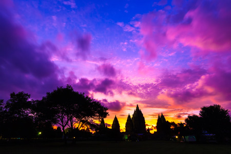 Silhouette of a temple complex against a beautiful red orange purple sky after sunset. Candi Prambanan Hindu Temple, Yogyakarta, Jawa, Indonesia.の写真素材