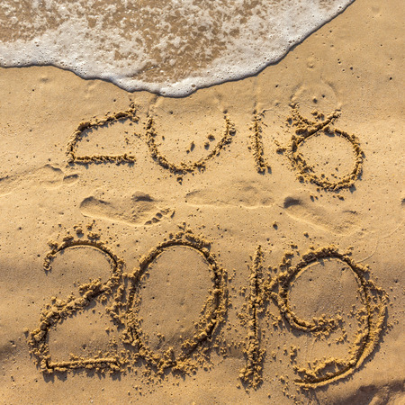 Concept of Happy New Year 2019 Wave water covering digits inscription. Meet at a tropical resort in Thailand.の写真素材