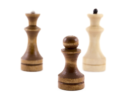 Black pawn and kings on a white backgroundの写真素材