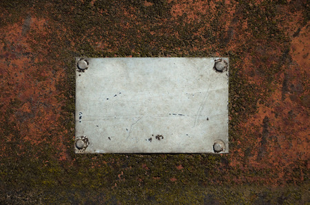 Metal gray plate with scratches on a rusty surfaceの写真素材