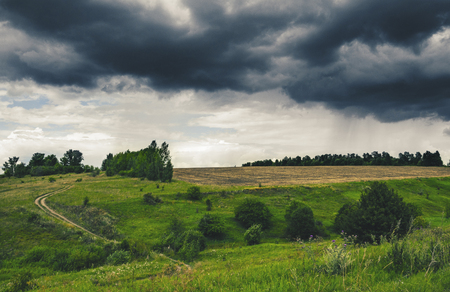 Cloudy windy summer landscape.の写真素材