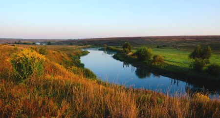 Tranquil morning landscape with river