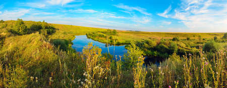Beautiful summer landscape with calm river at sunset