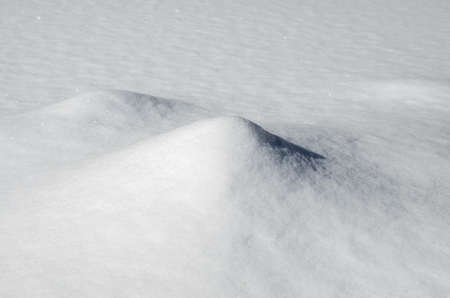 Abstract winter snowy background with two small hillocks.の写真素材