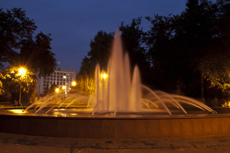 night photo of beautiful fountain in the parkの写真素材