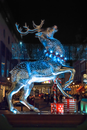 London, United Kingdom - December 29, 2014: Silver reindeer decoration at Covent Garden as seen at night on 29th of December, 2014.のeditorial素材