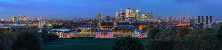 London, UK - October 25, 2015: Night panoramic picture of Greenwich Park near Queen's House and the Naval College and with the Canary Wharf skyline with its corporate office buildings in the background.のeditorial素材