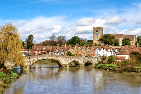 View of Aylesford village in Kent, England with medieval bridge and church.