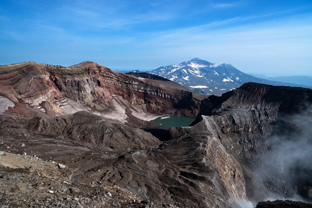 At the top of the volcano are visible: crater lake, gases sulfur fumaroles, and the nearby volcanoの写真素材