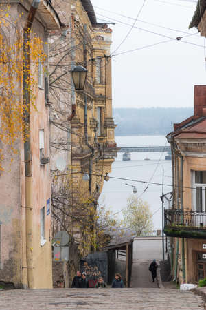 VYBORG, RUSSIA - OCTOBER 31, 2021: Tourists walk along the old hills of Vyborg. loudy autumn day.のeditorial素材