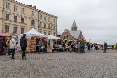 VYBORG, RUSSIA - OCTOBER 31, 2021: Market square in Vyborg. Tourists walk along the old medieval streets of Vyborg. loudy autumn day.のeditorial素材